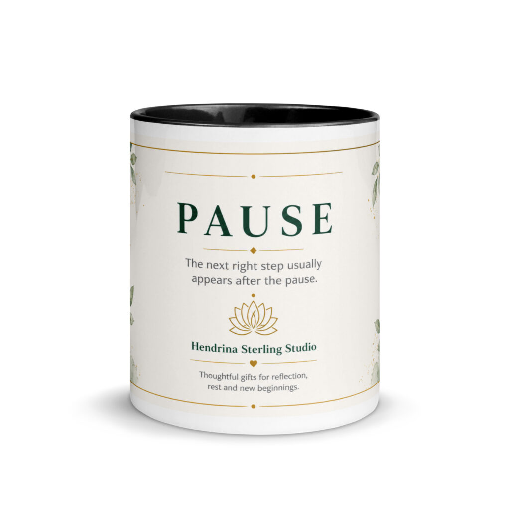 Black ceramic mug with colorful interior printed with the Pause mindfulness design